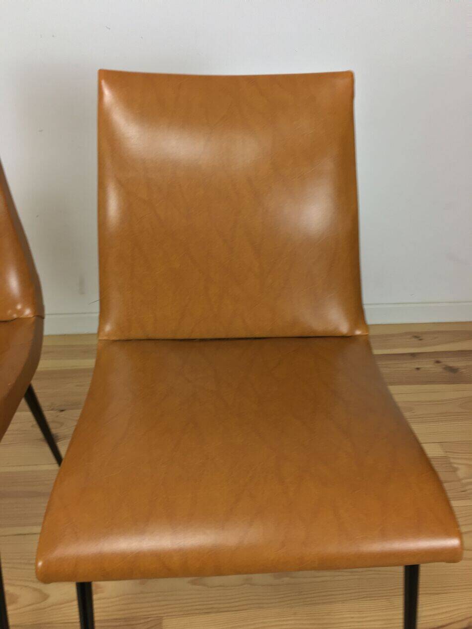 Pair of 1950s chairs with compass legs and brown faux leather.