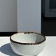 Small white glazed ceramic bowl black edges