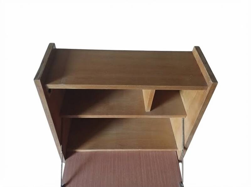 Vintage 1960s secretary desk with an angled design, light wood, and tapered legs.