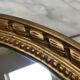 Large oval mirror in wood gilded with fine gold