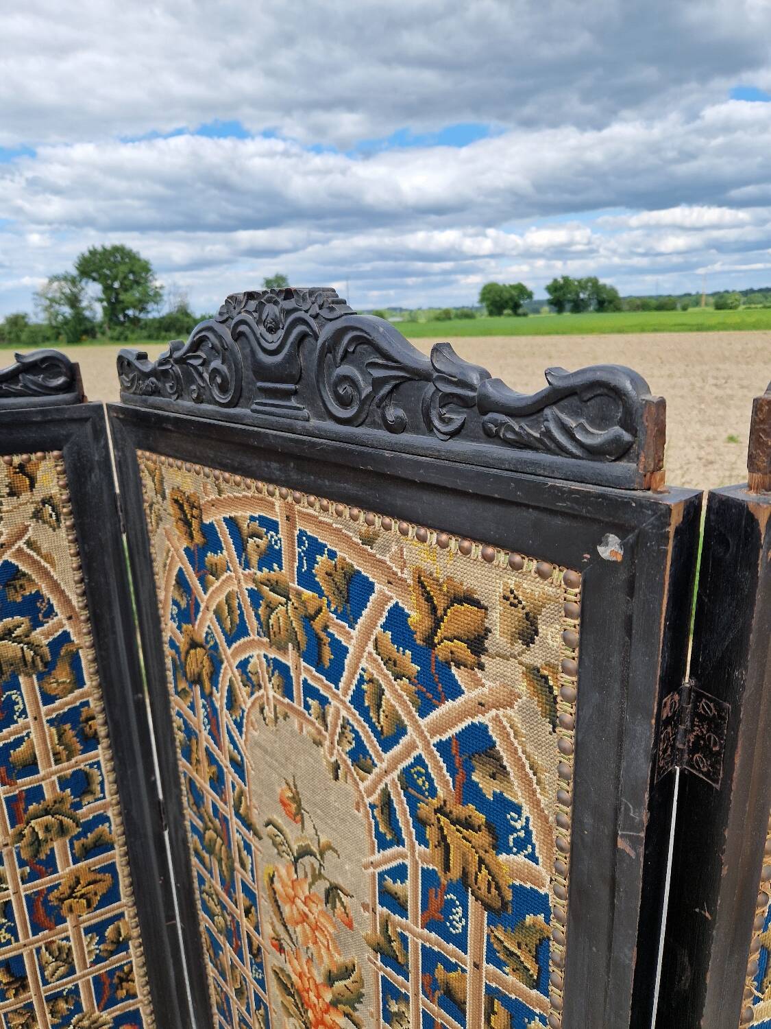 Folding screen in black-painted wood, 19th century
