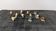 Set of 11 miniature birds in polychrome glazed ceramic.