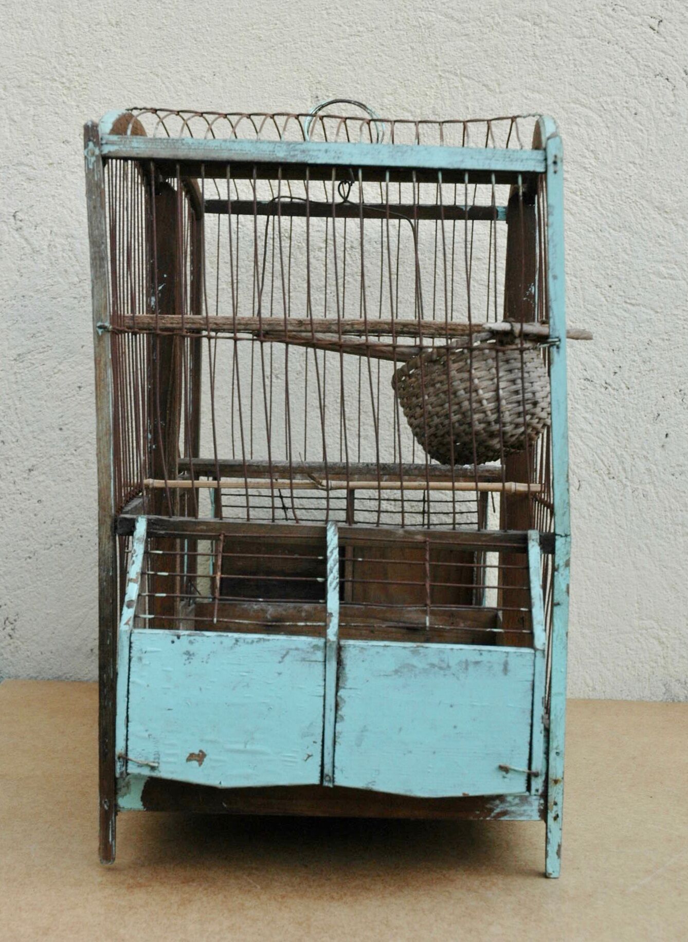 Ancient bird cage in wood and metal