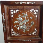 Asian screen in carved wood and mother-of-pearl marquetry.
