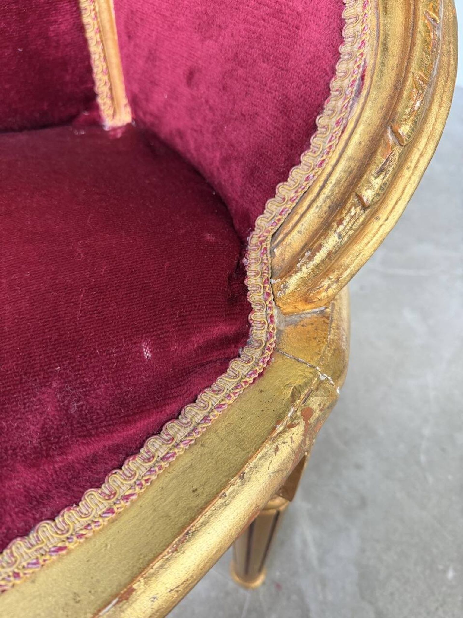 Louis XVI gilt wood and red velvet armchair