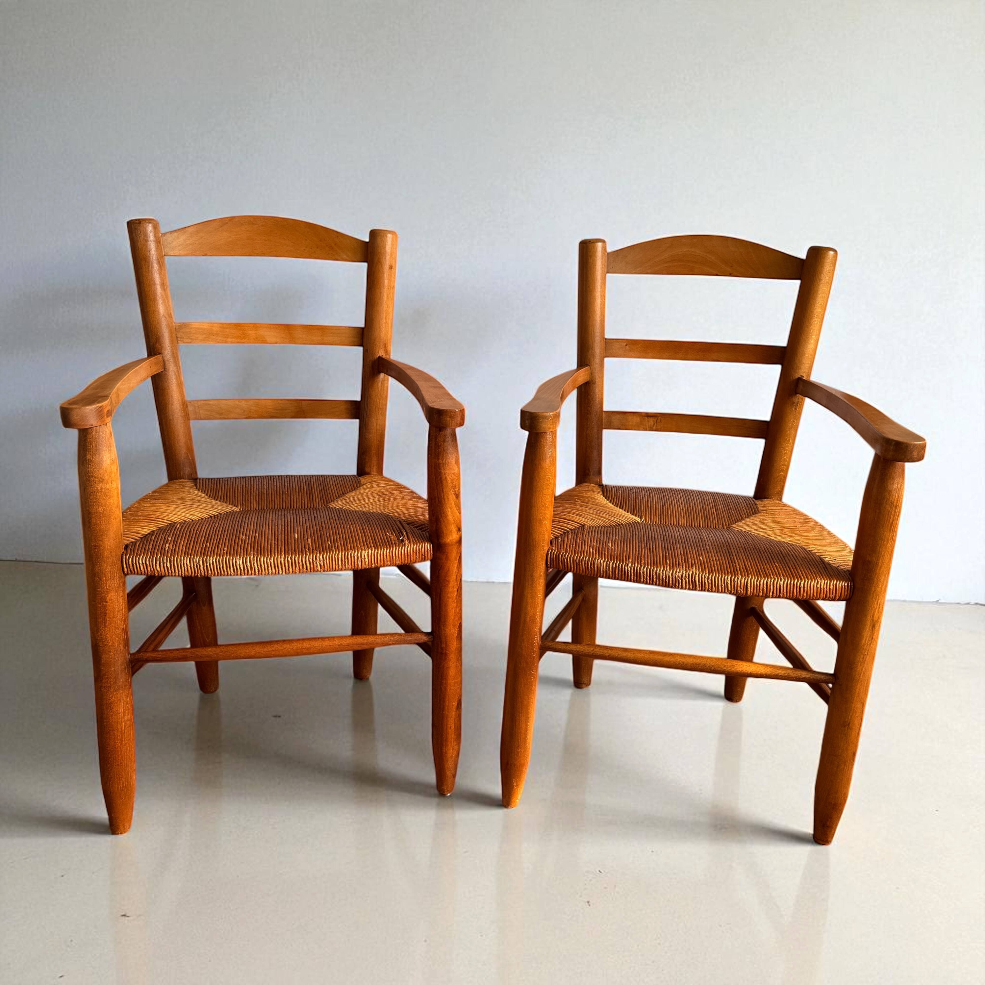 Pair of vintage armchairs in solid wood and straw – Georges Robert