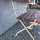 Folding garden bench in wrought iron and wood