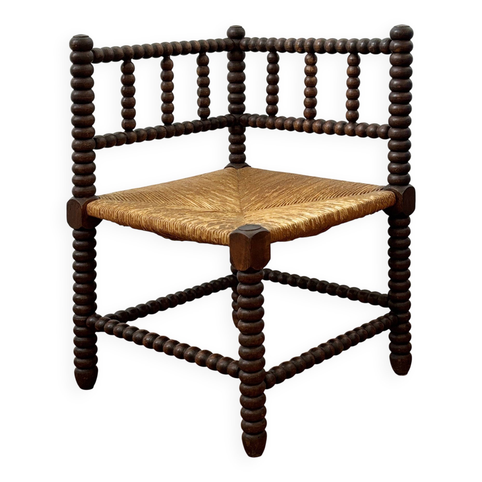 Turned wood corner chair with straw seat
