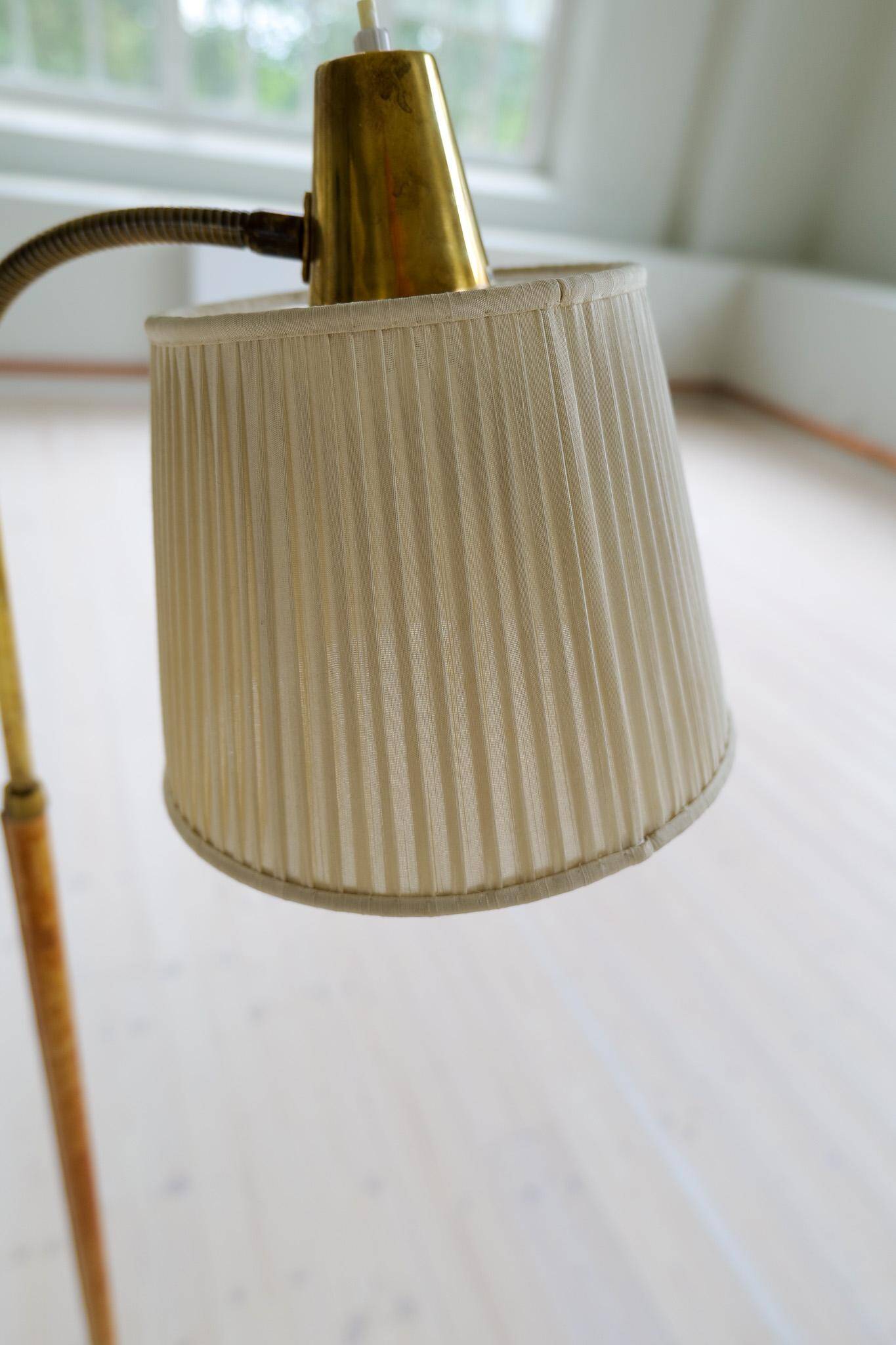 Mid-century brown leather and brass floor lamp, Falkenbergs Belysning, Sweden, 1960s.