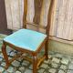 Vintage Louis XV chair made of carved solid wood with blue velvet fabric.