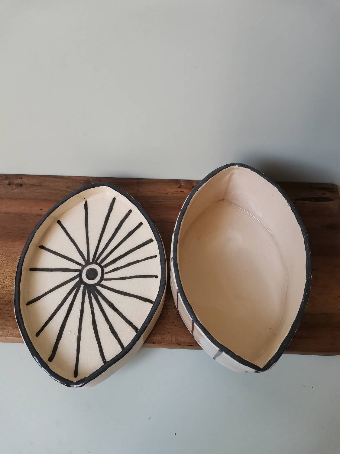 Vintage artisanal rustic ceramic butter dish with geometric eye pattern
