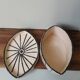 Vintage artisanal rustic ceramic butter dish with geometric eye pattern