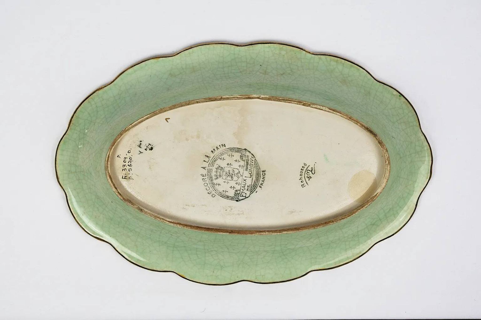 Longwy cup in cloisonné enamels on a green background, polychrome floral decoration and gold