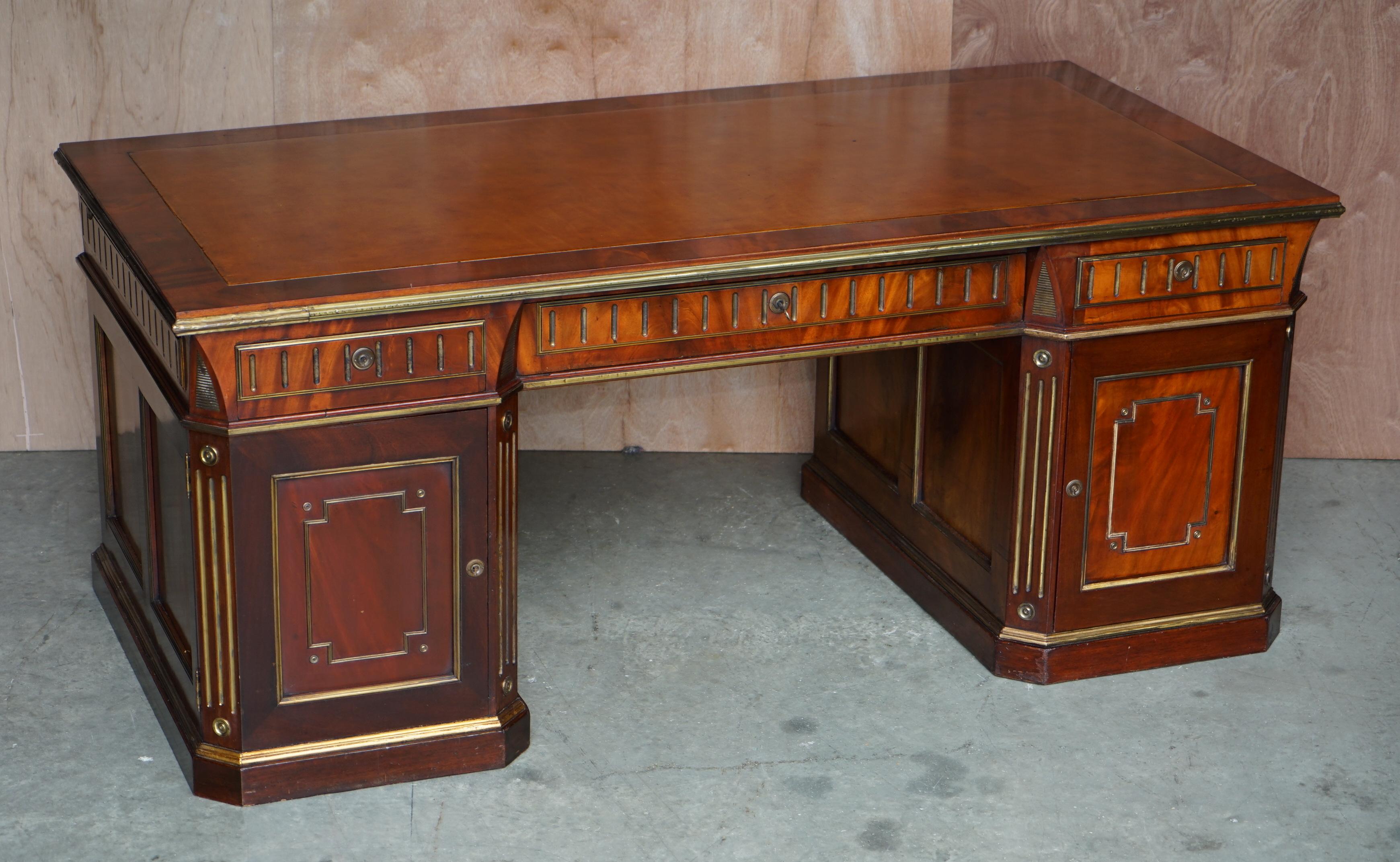 Restored antique Russian hardwood partner desk and leather armchair.