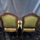 Paire de larges fauteuils XIXe en cuir vert de style Louis XV