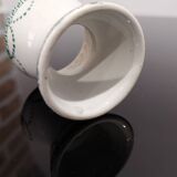 Old porcelain diabolo egg cup decorated with green frieze and garlands