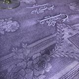 Old damask tablecloth in linen and purple silk
