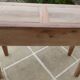 Console in solid walnut with a natural finish, featuring three drawers with a belt.