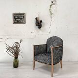 Club armchair in wood and fabric.