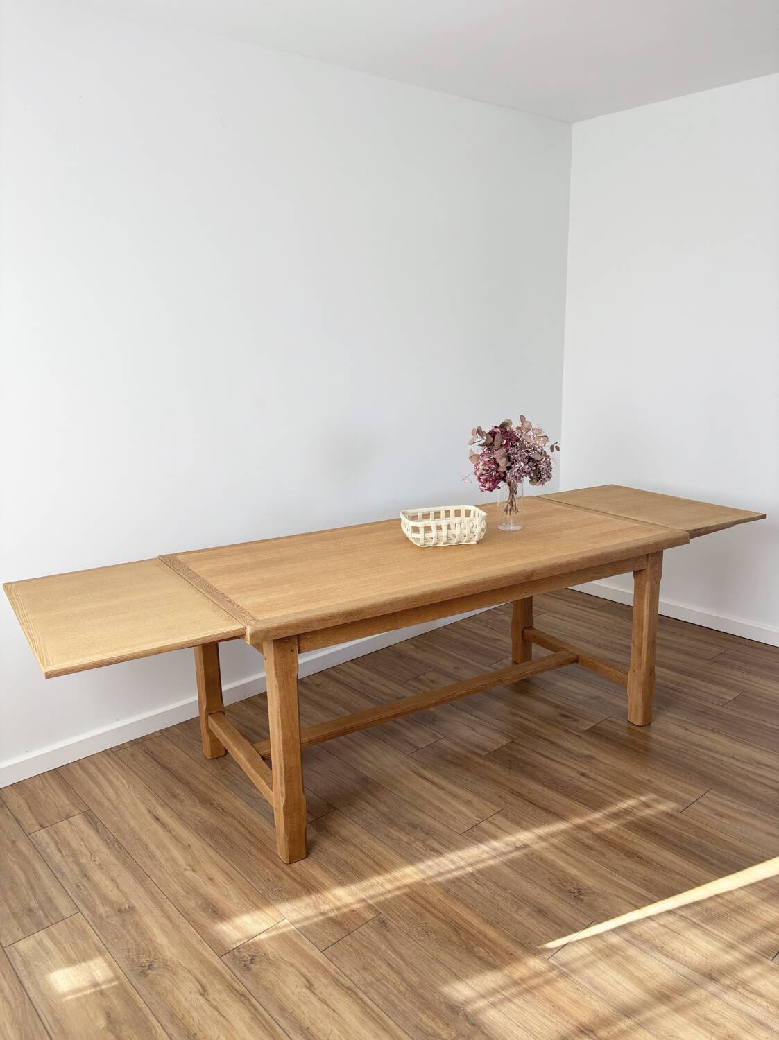 Solid oak farmhouse table with extensions.