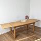 Solid oak farmhouse table with extensions.