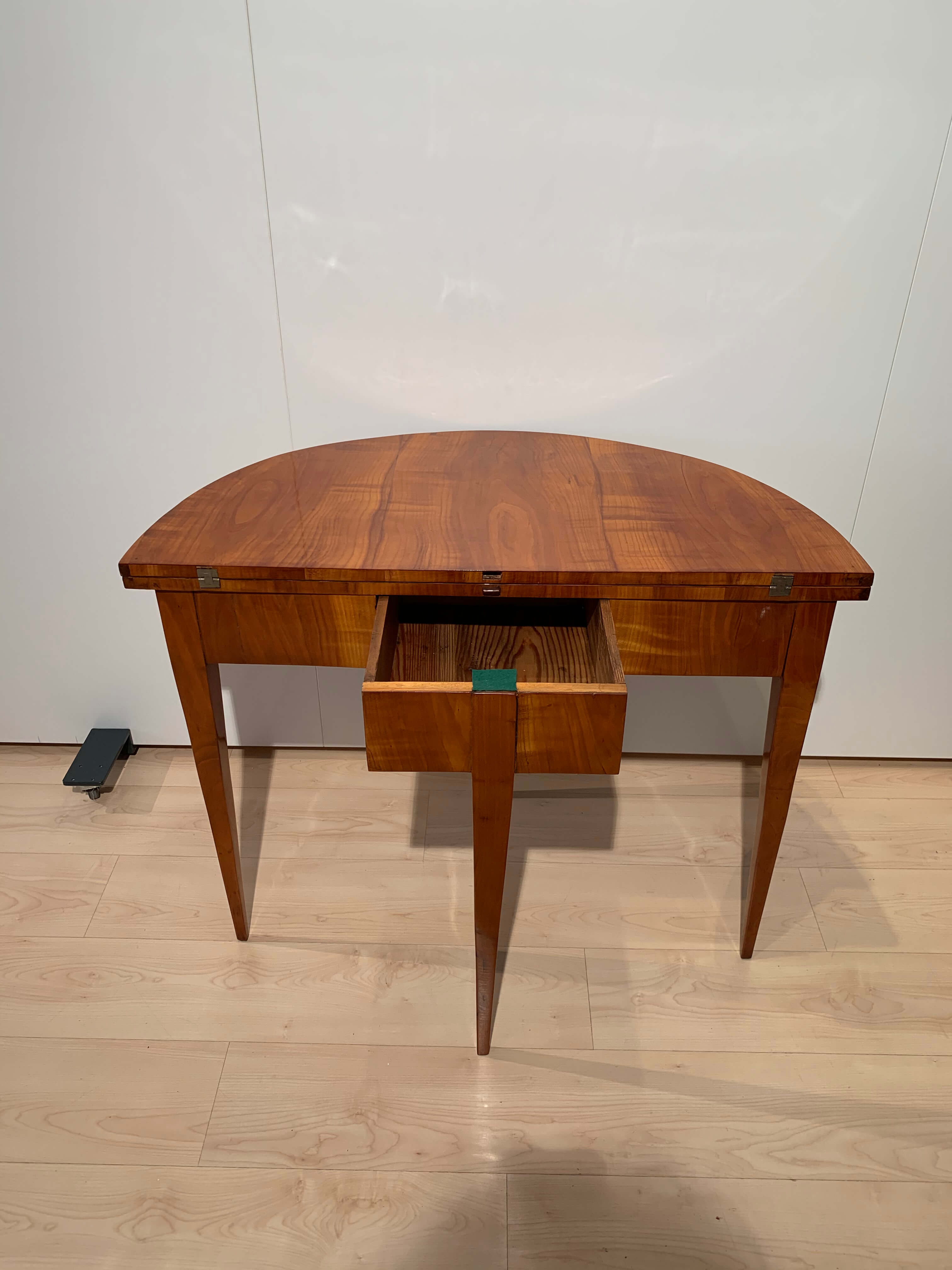 Biedermeier demi-lune fold-out table, cherry veneer, south germany, circa 1820