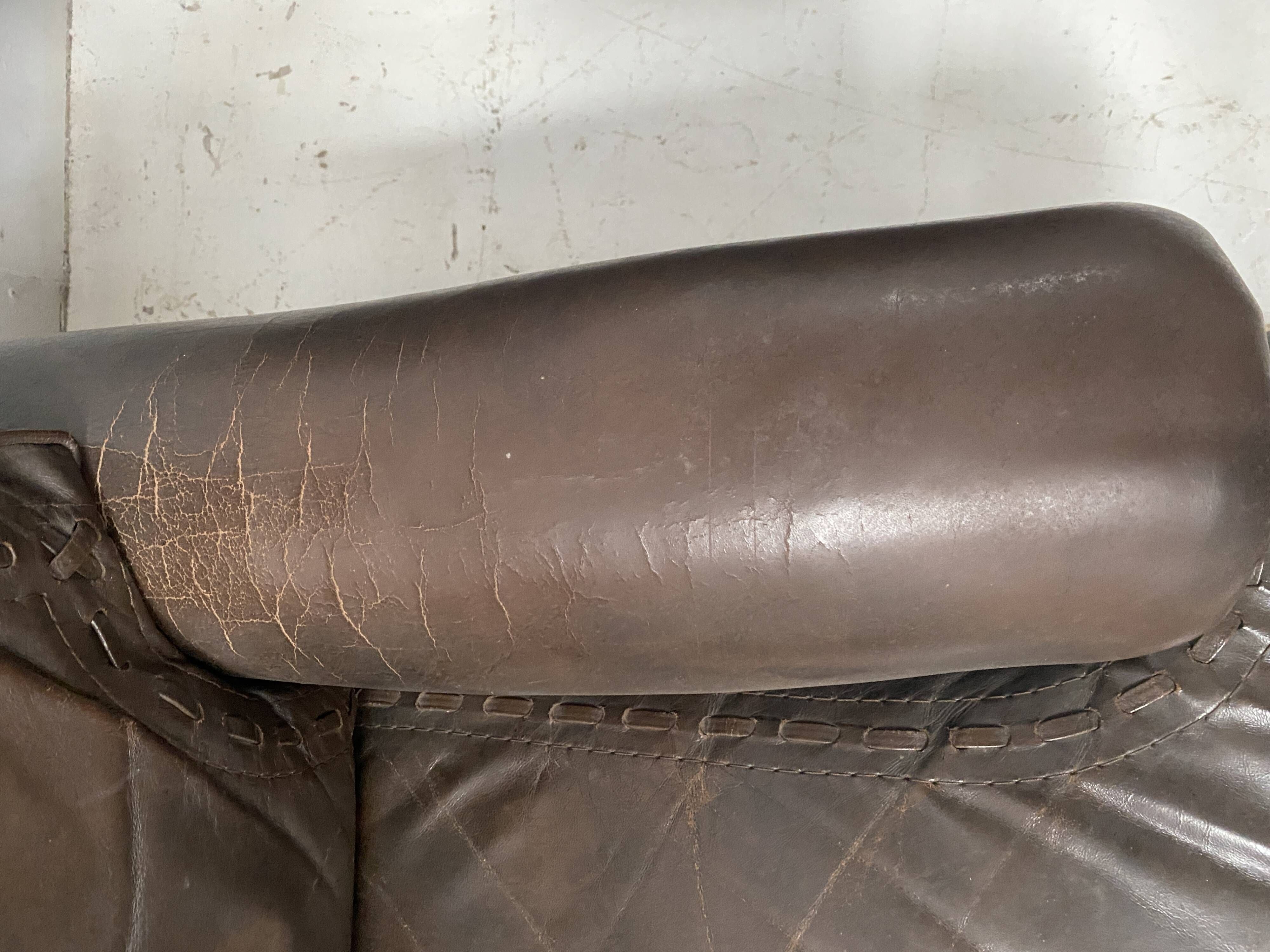 Pair of vintage brown leather armchairs from the 1970s.