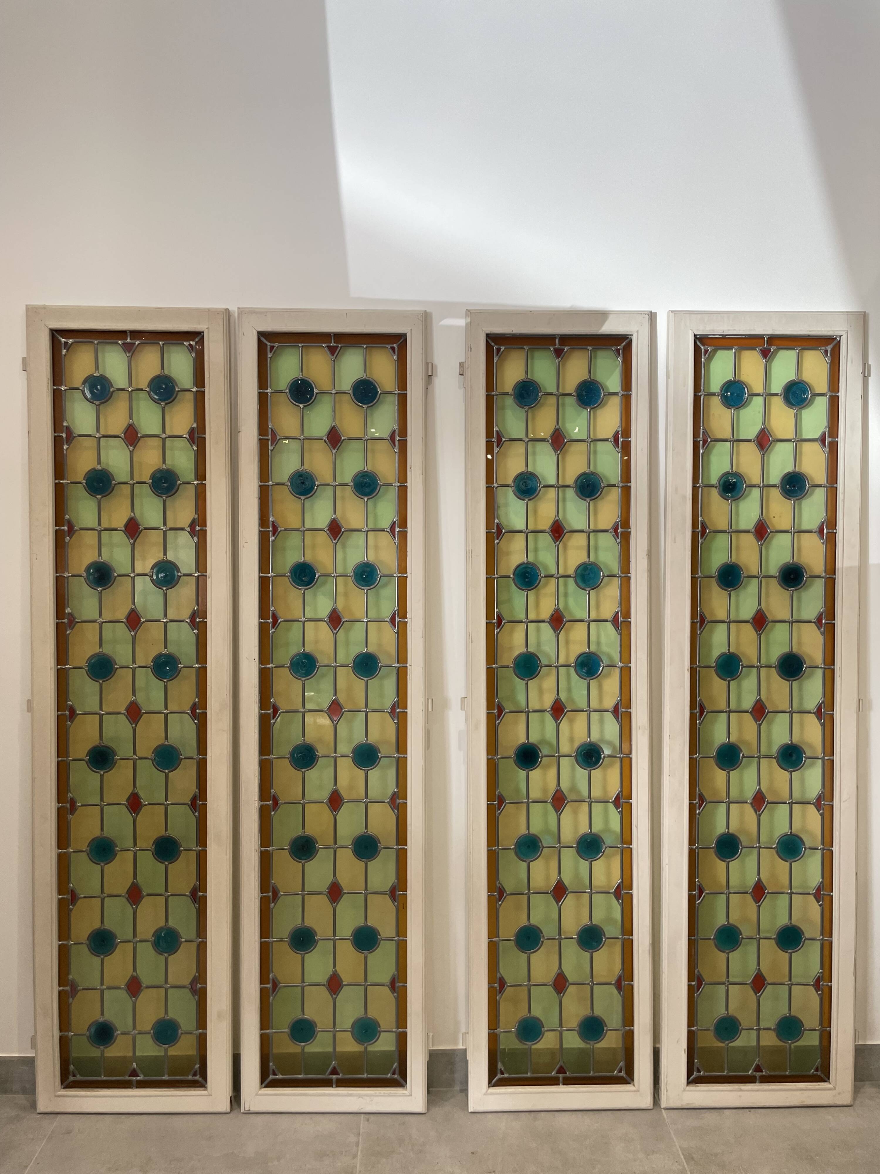 4 vintage faux stained glass panels that can form a screen or a partition