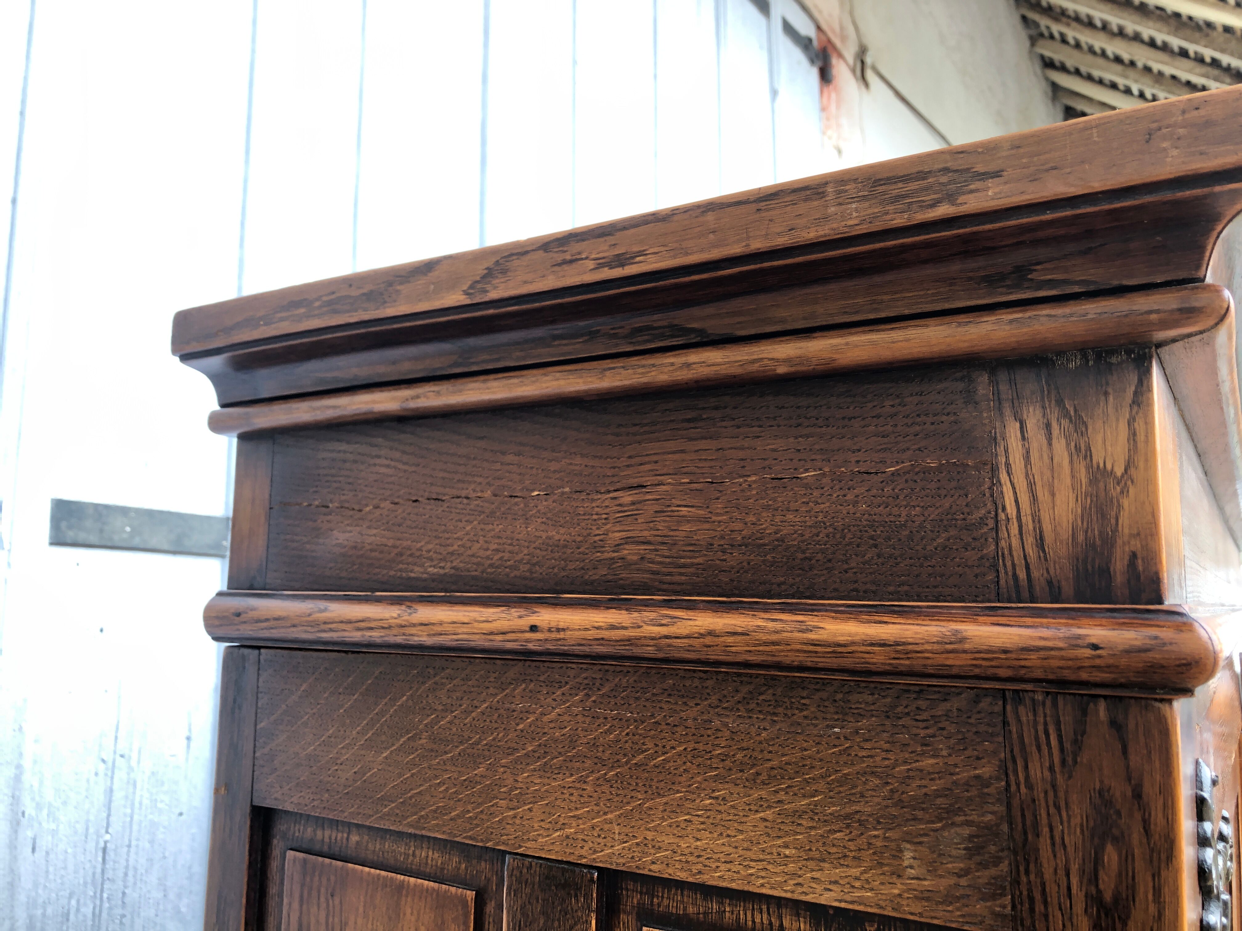 Spanish furniture with carved wood profiles and coats of arms from the 1950s.