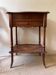 Dark wood hairdresser's workbench in walnut colour with mirror.