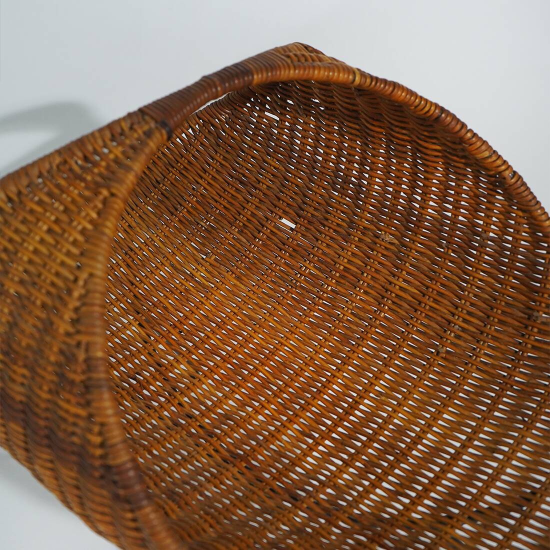 Rattan magazine rack with metal legs, 1950s