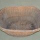 Rustic brown wicker basket from the 1940s — large oval laundry basket