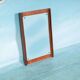 Minimalist Scandinavian mirror in teak with a vintage design.