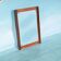 Minimalist Scandinavian mirror in teak with a vintage design.