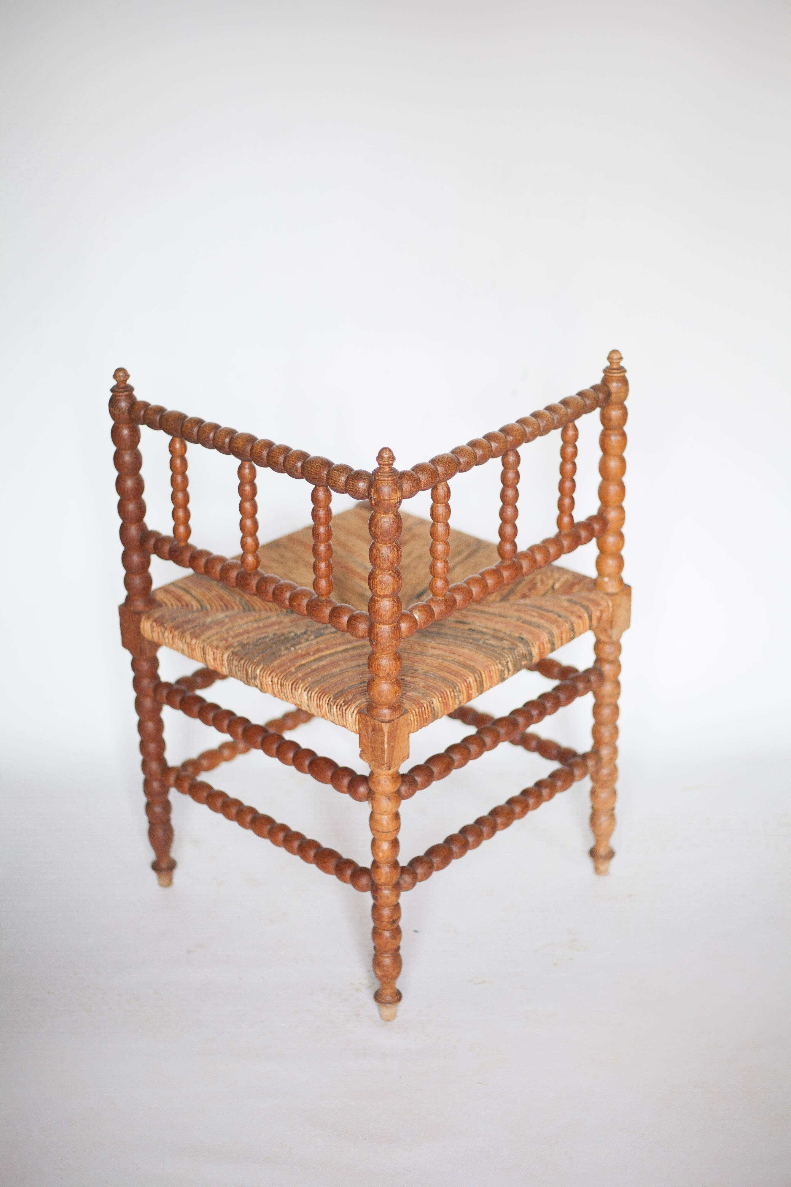 Wooden and caned corner chair, antique bobbin chair, occasional chair.