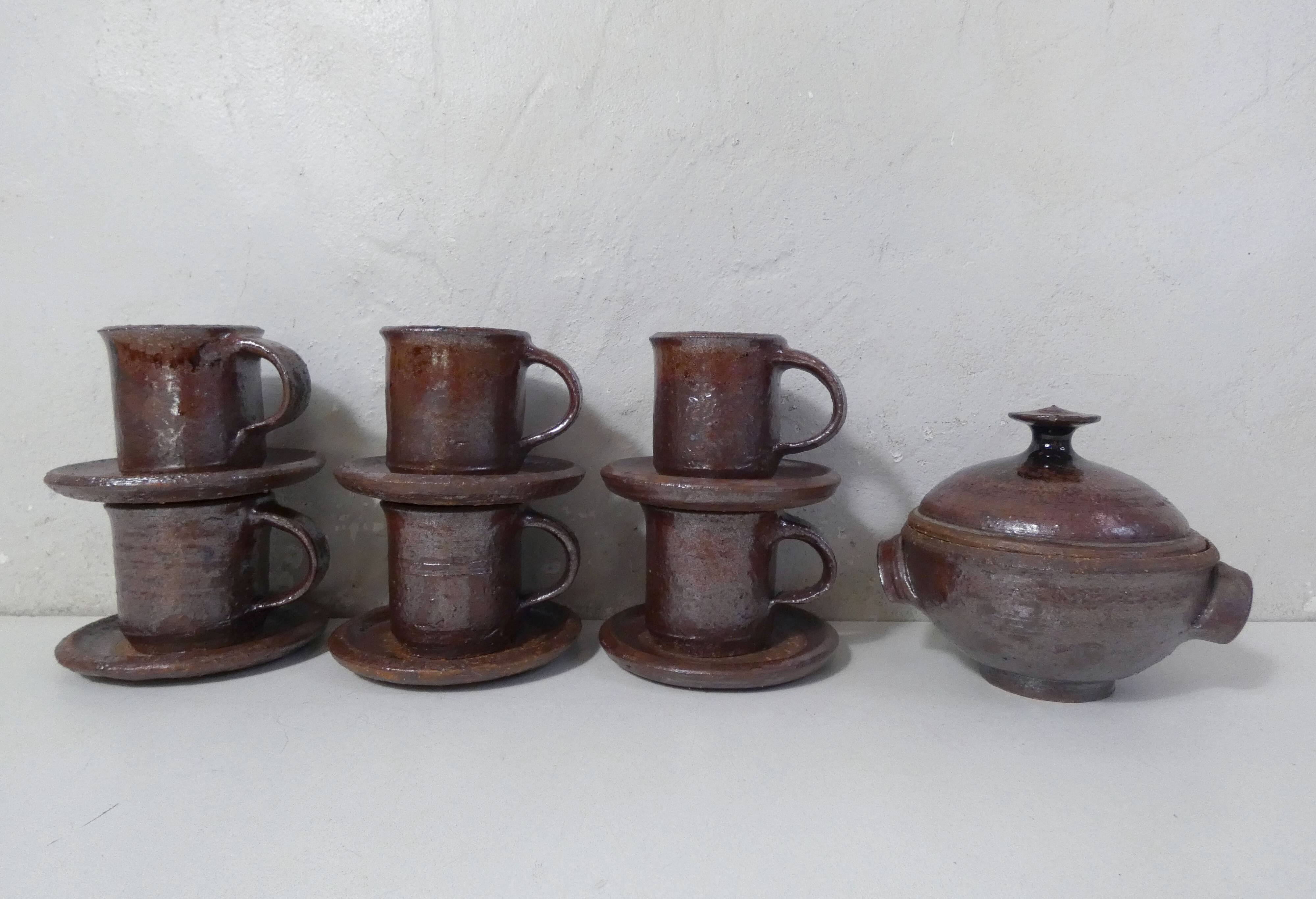 coffee service in iridescent stoneware cups and vintage sugar bowl