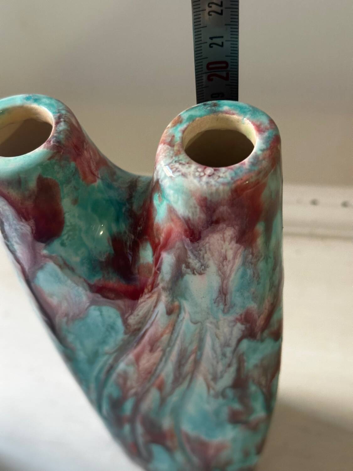 Vintage pair of turquoise and red ceramic candlesticks