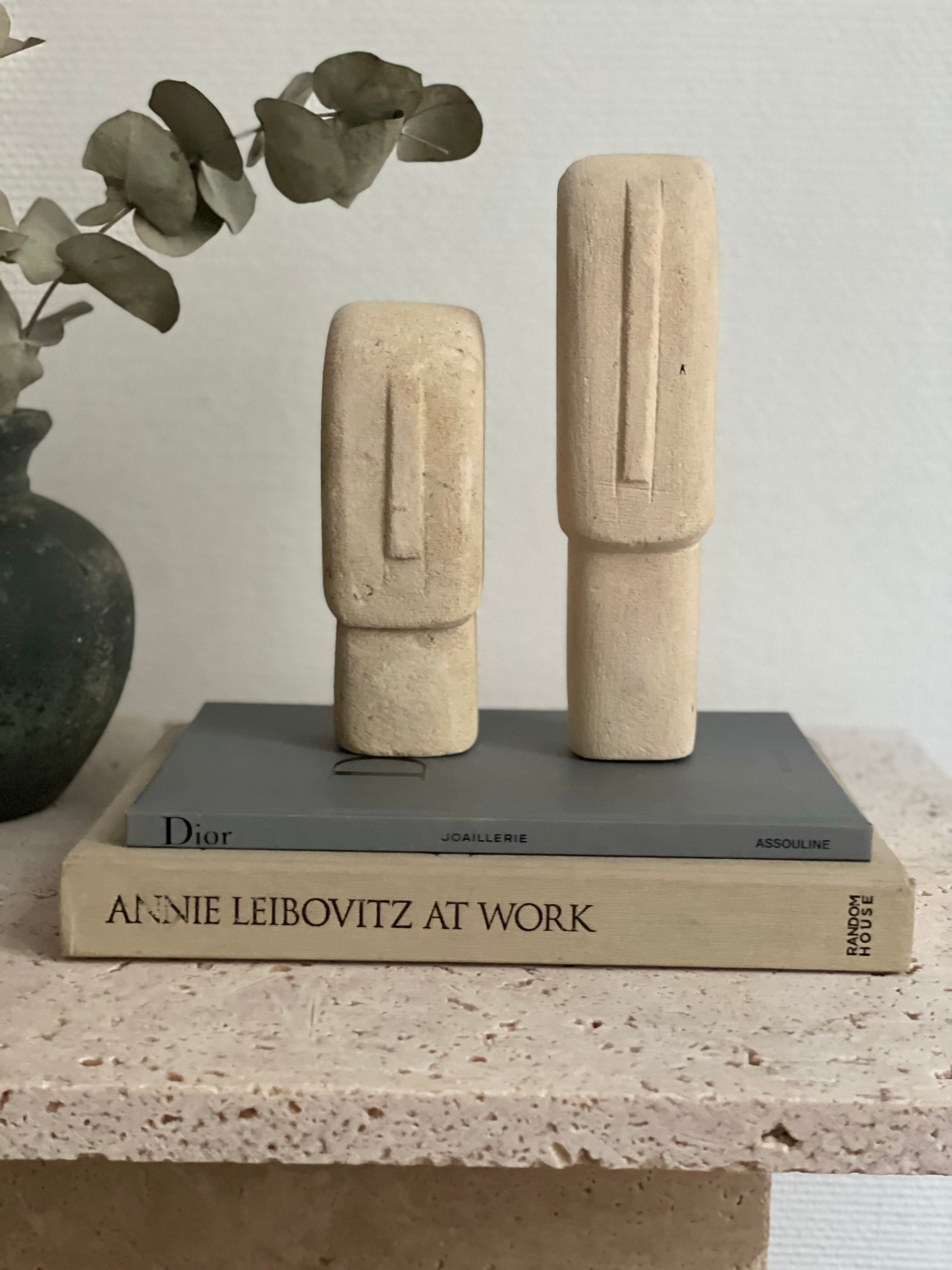 Set of two minimalist stone face statues