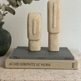 Set of two minimalist stone face statues