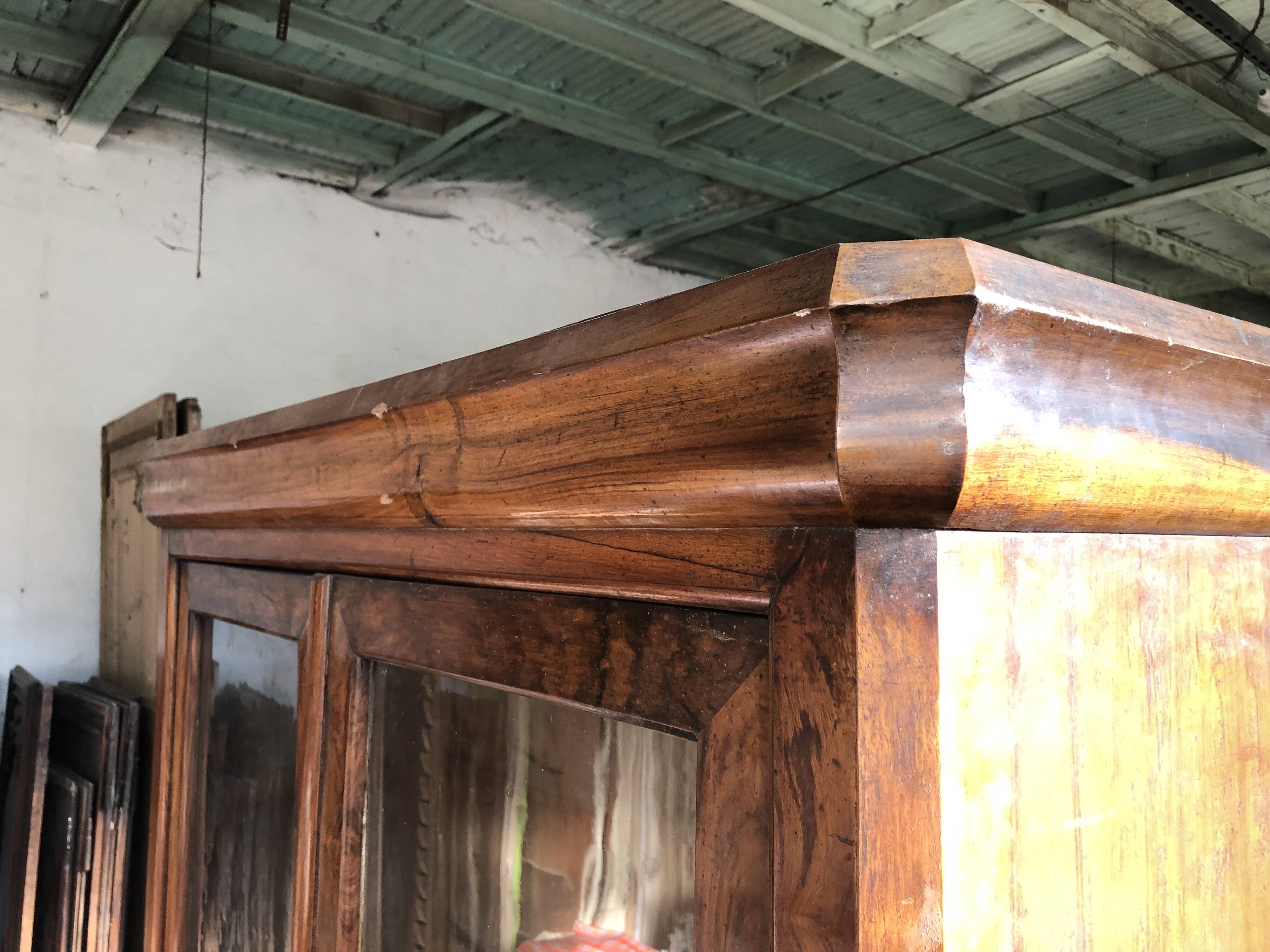 Louis Philippe two-body bookcase in walnut wood.