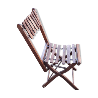 Old folding chair in wood and metal