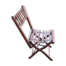 Old folding chair in wood and metal