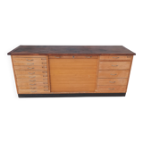 Workshop furniture with drawers and curtain in beech and walnut.