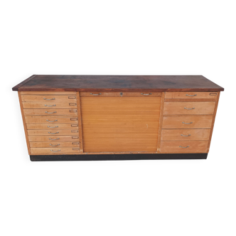 Workshop furniture with drawers and curtain in beech and walnut.