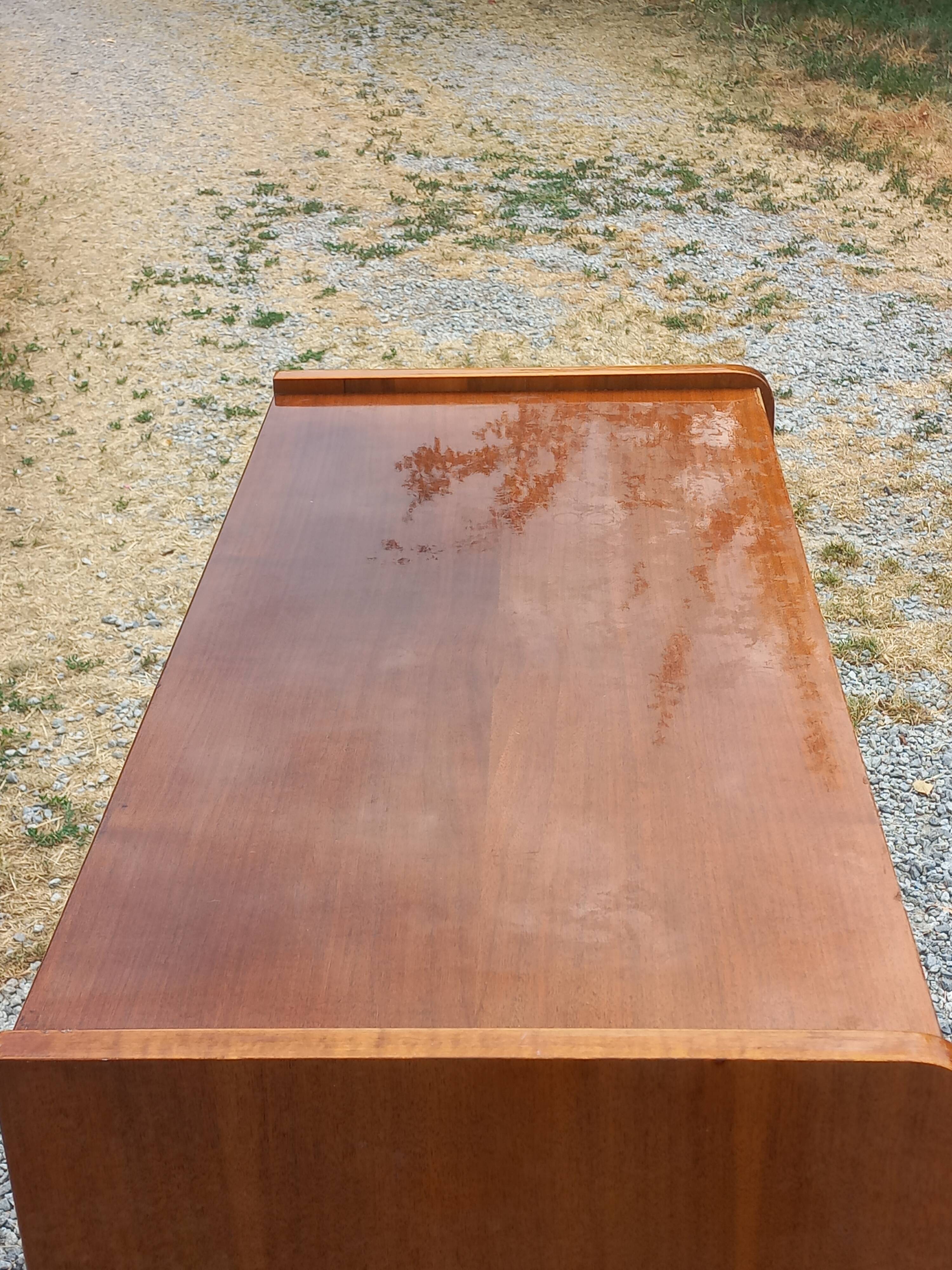 Vintage walnut varnished chest of drawers with 4 drawers from the 1960s.