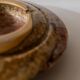 Vintage onyx ashtray from the 1980s, large round, brutalist design, brown and beige tones, sculptural table accent, modernist object, elegant gift idea.