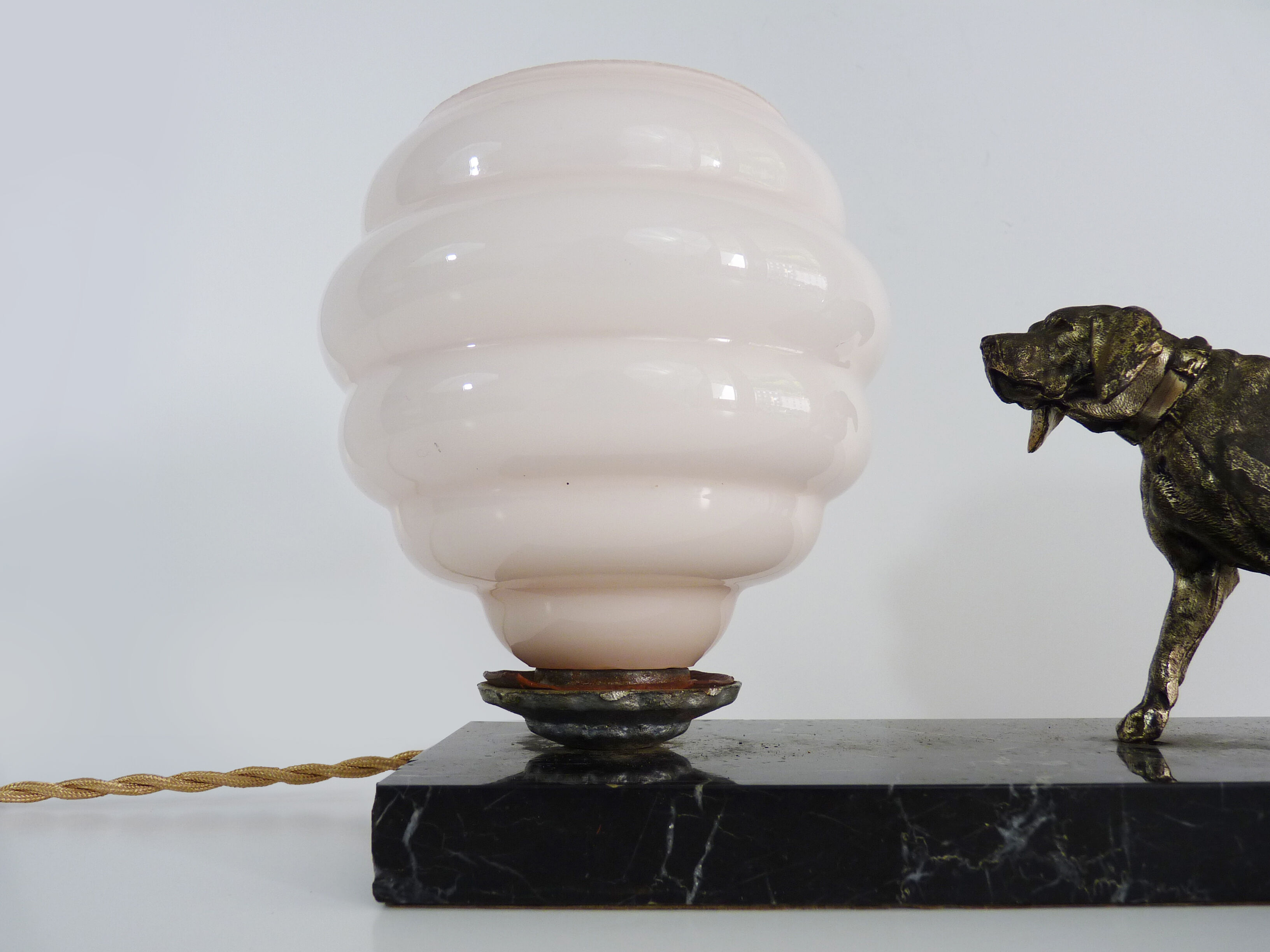 Lamp, Art Deco night light, dog on black marble base, pink globe. Year 30