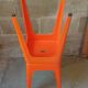 Pair of AMI stools in orange plastic