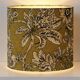 Lampshade dressed in a modern tropical-inspired pattern blending