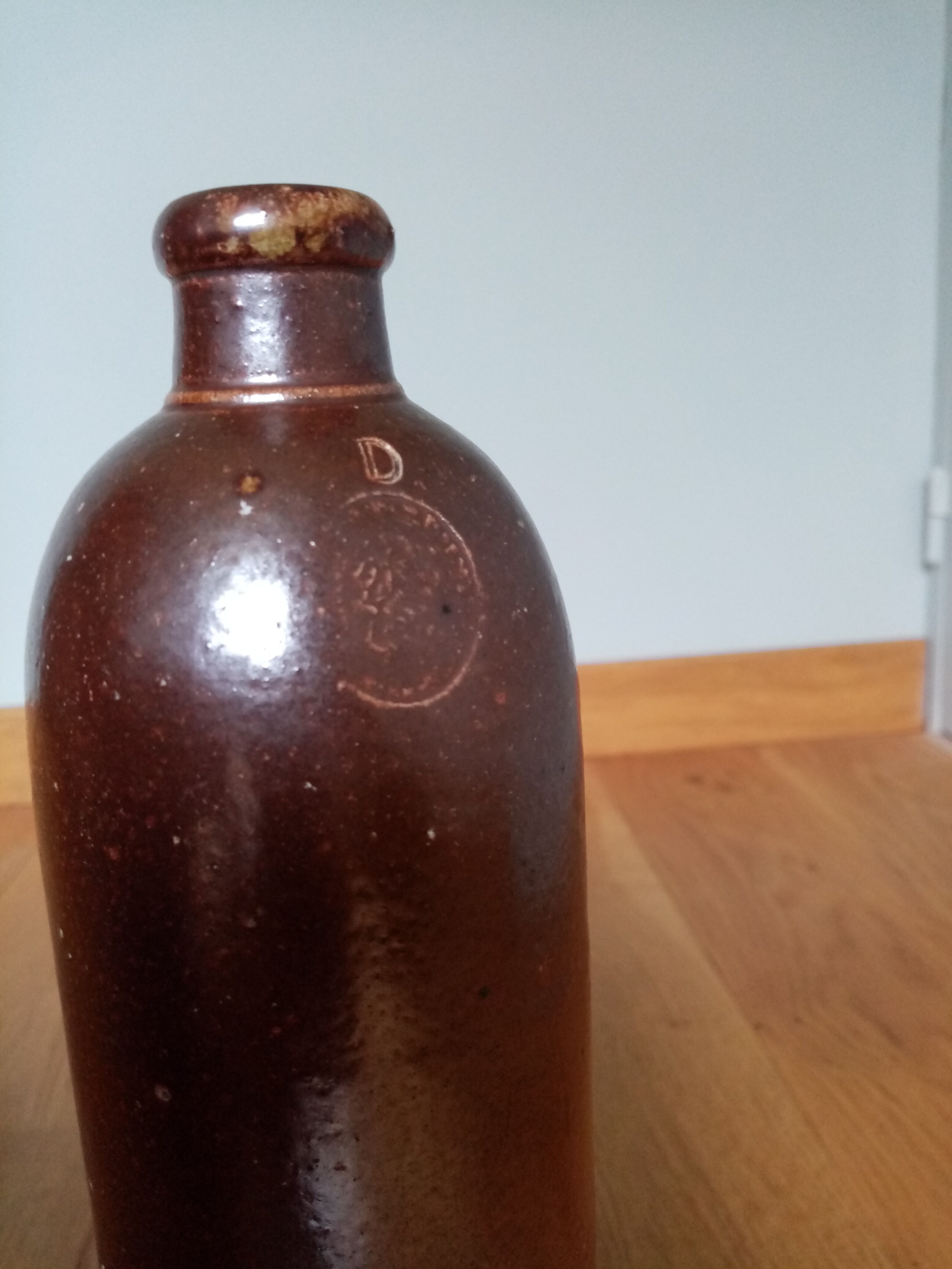 High bottle with brown enamelled sandstone handle Amsterdam